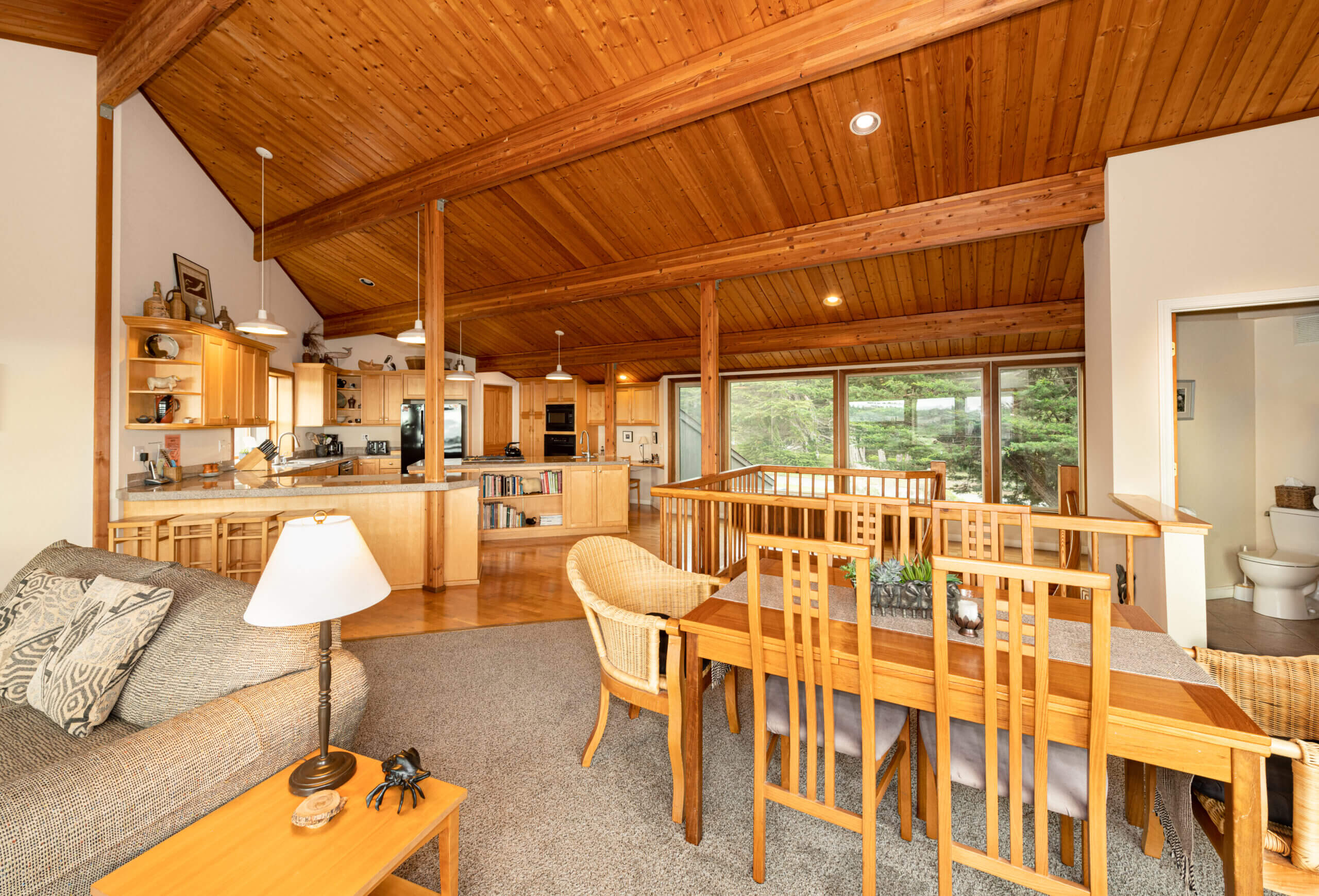 Pelicans Rest upper living area, dining area , kitchen with wood beam ceilings