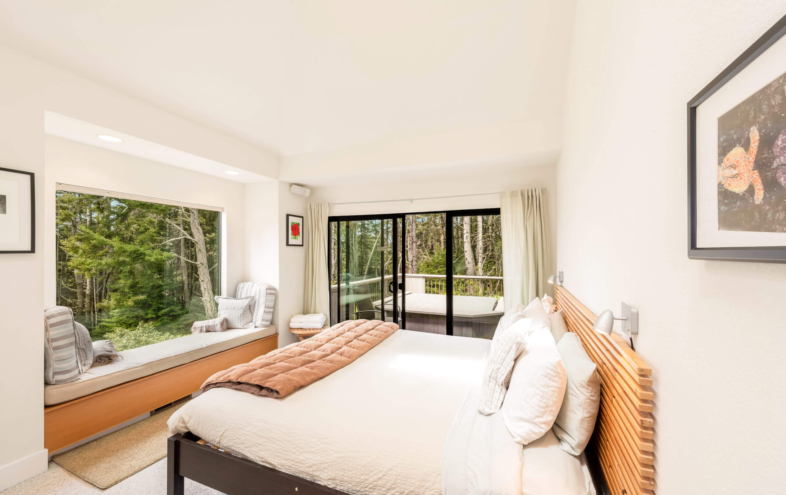 Sea Ridge master bedroom with king bed and door to patio