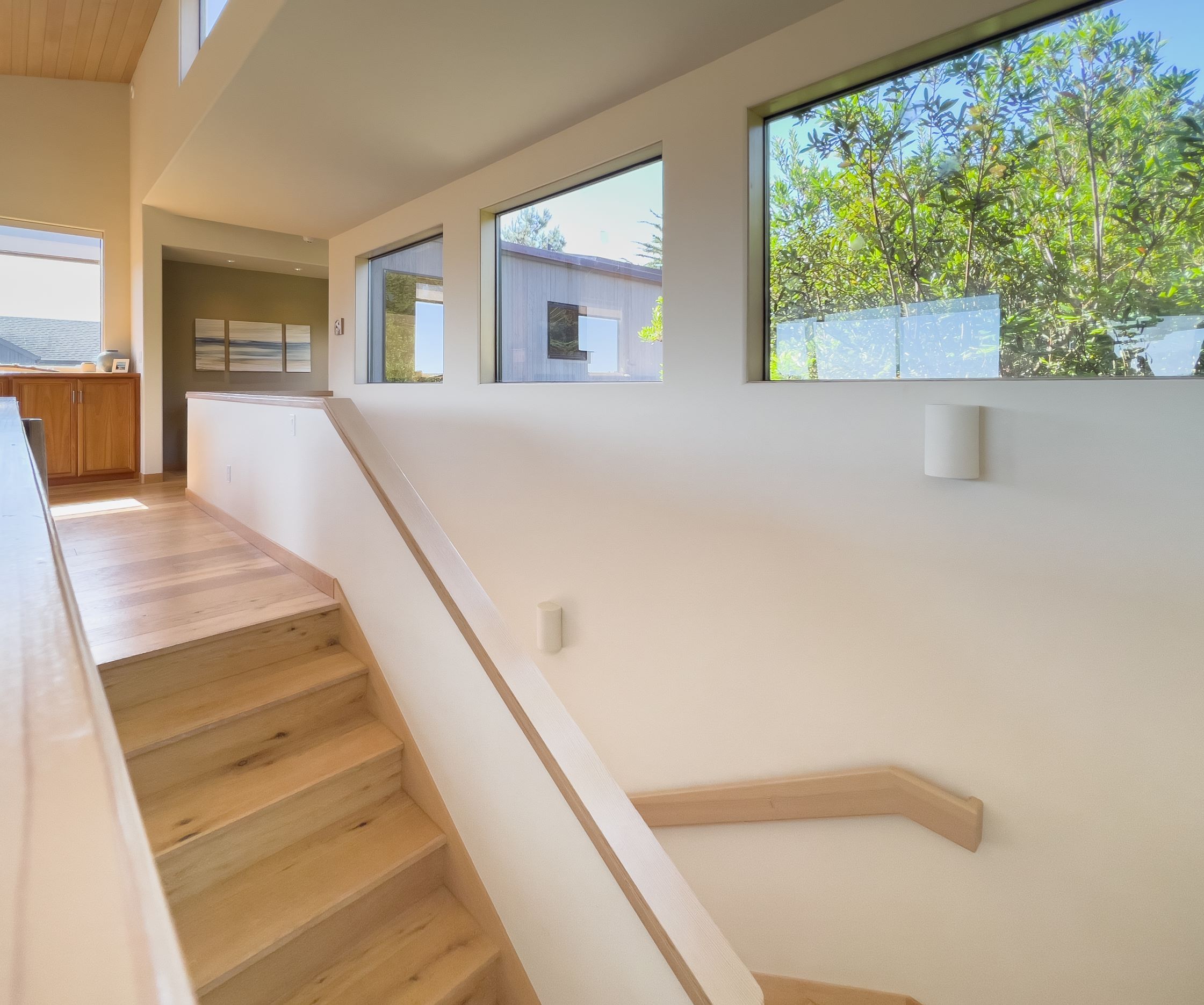Solstice - wooden staircase with bright windows
