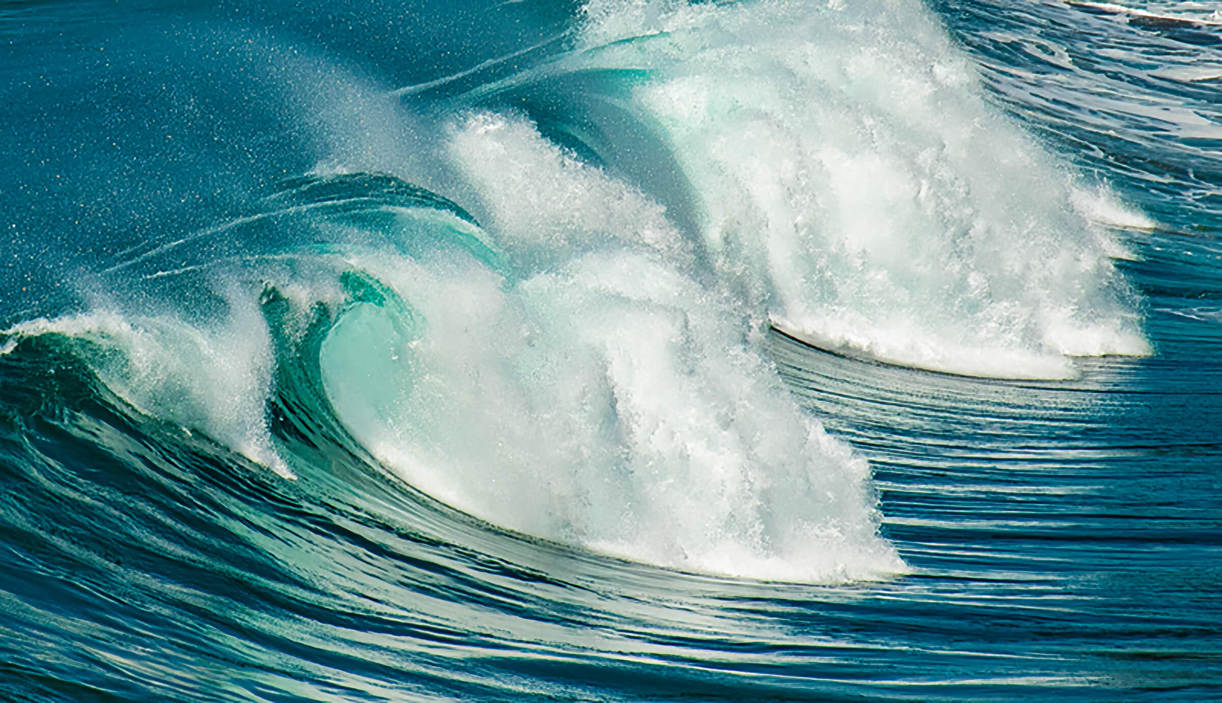 Lightfoot - white foamy wave on sparkling blue ocean