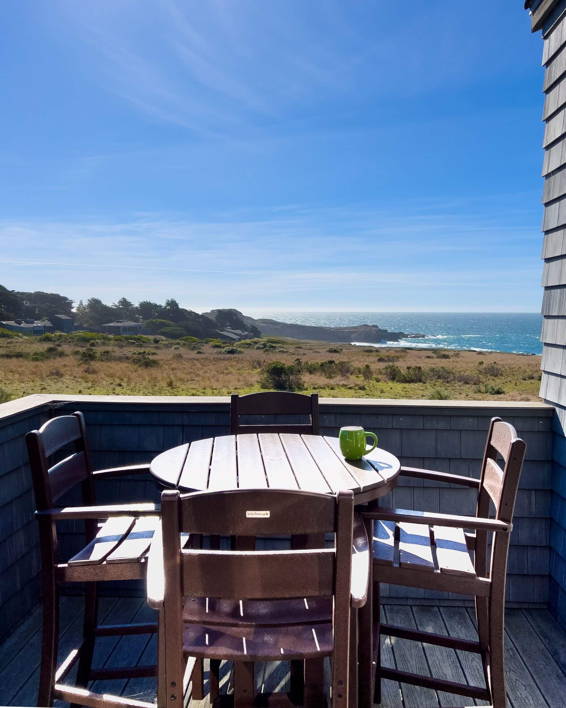 Lighthouse - exterior deck small dining table with ocean view