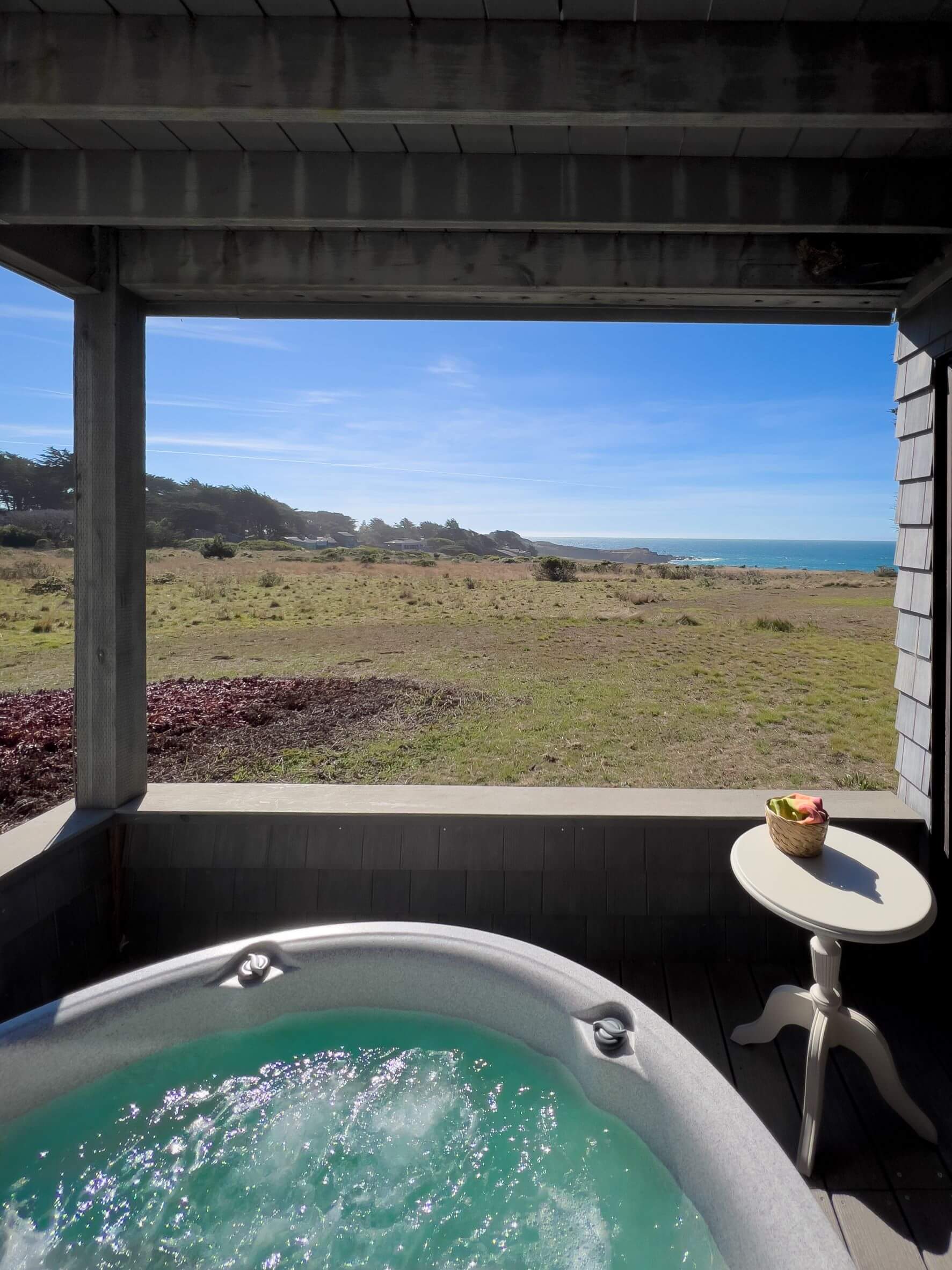 Lighthouse - exterior hot tub under covered deck with view of ocean meadow