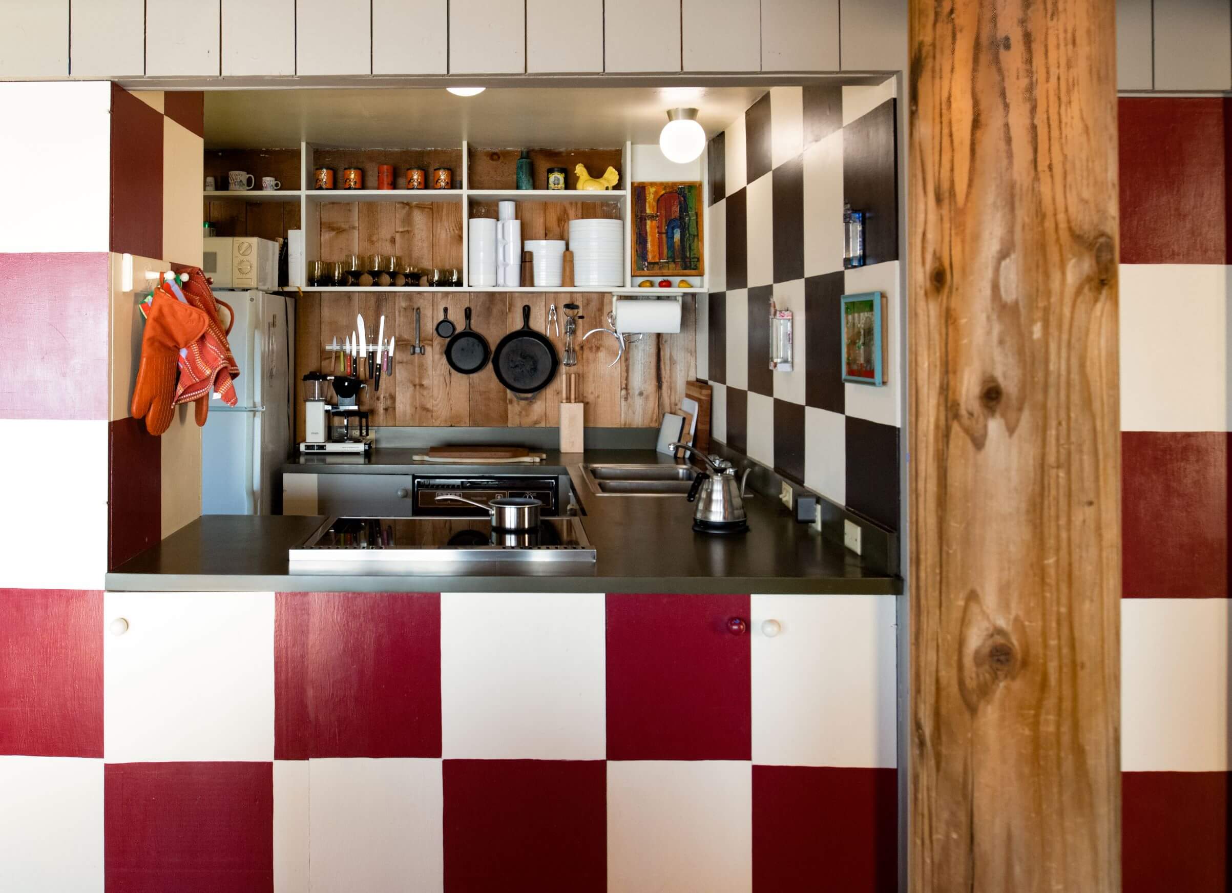 Moore Condo #9 - kitchen passthrough counter with red and white checkered patterned wall.