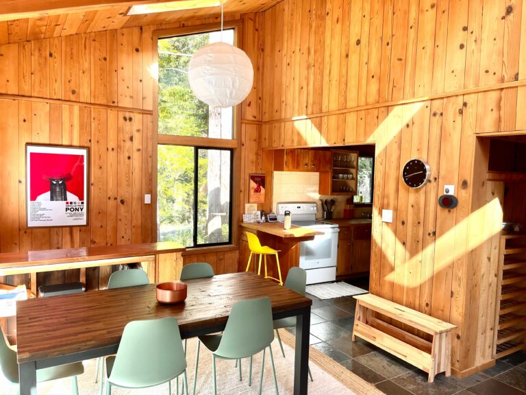 Sea Pony - bright wood paneled room view of kitchen and dining table