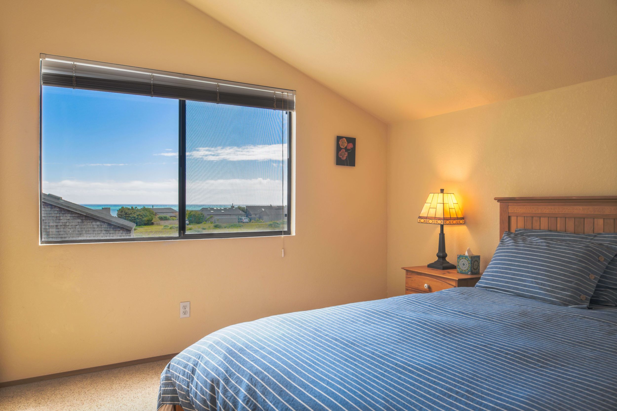 Mare Vista: small queen bedroom with bright window with ocean view.