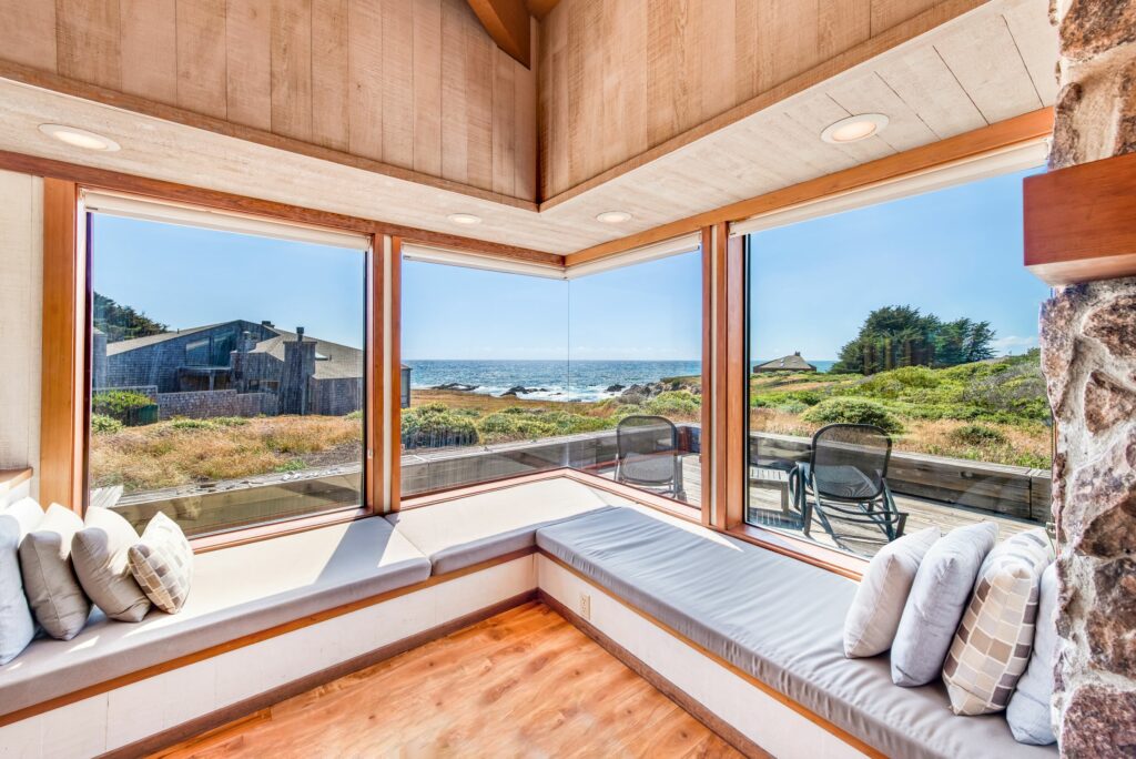 Cove Overlook: corner window seat with large windows looking to cove