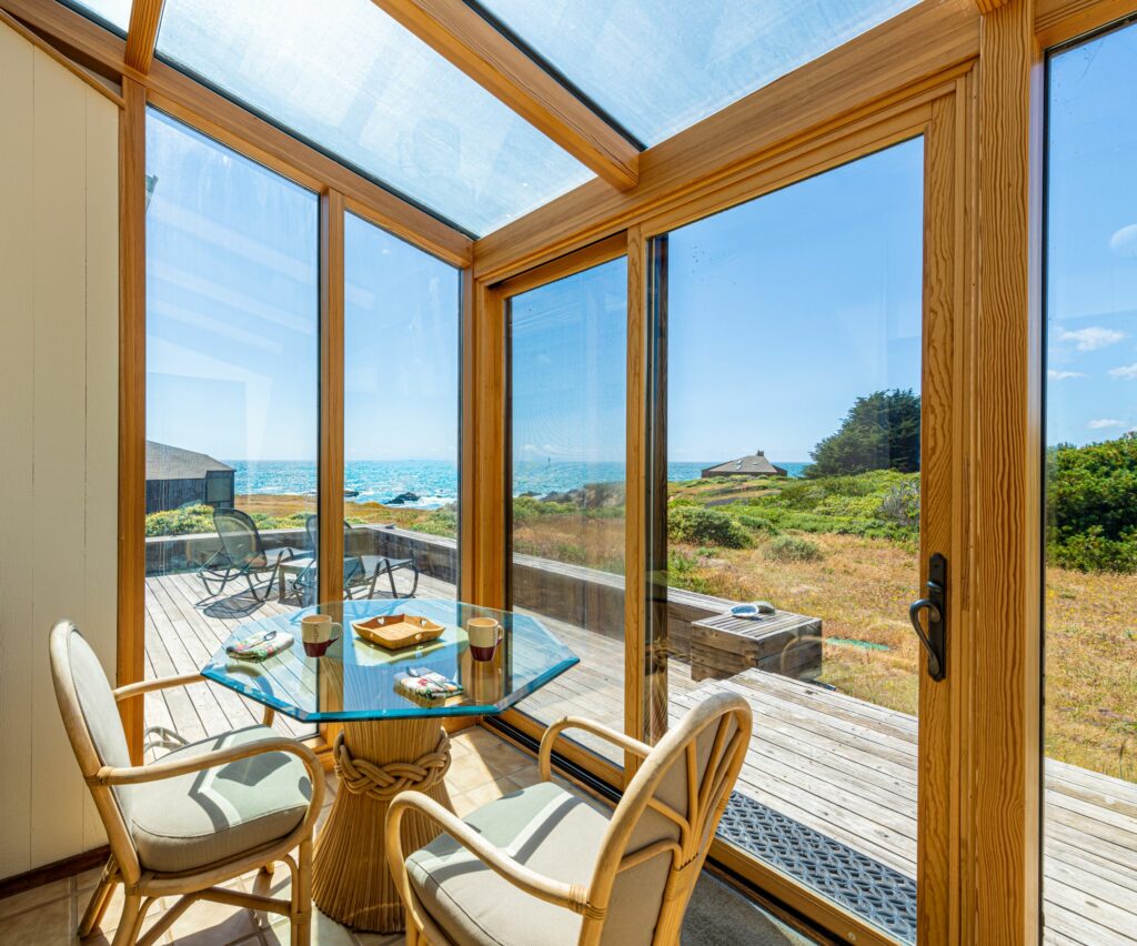 Cove Overlook: dining area with large windows looking onto ocean cove