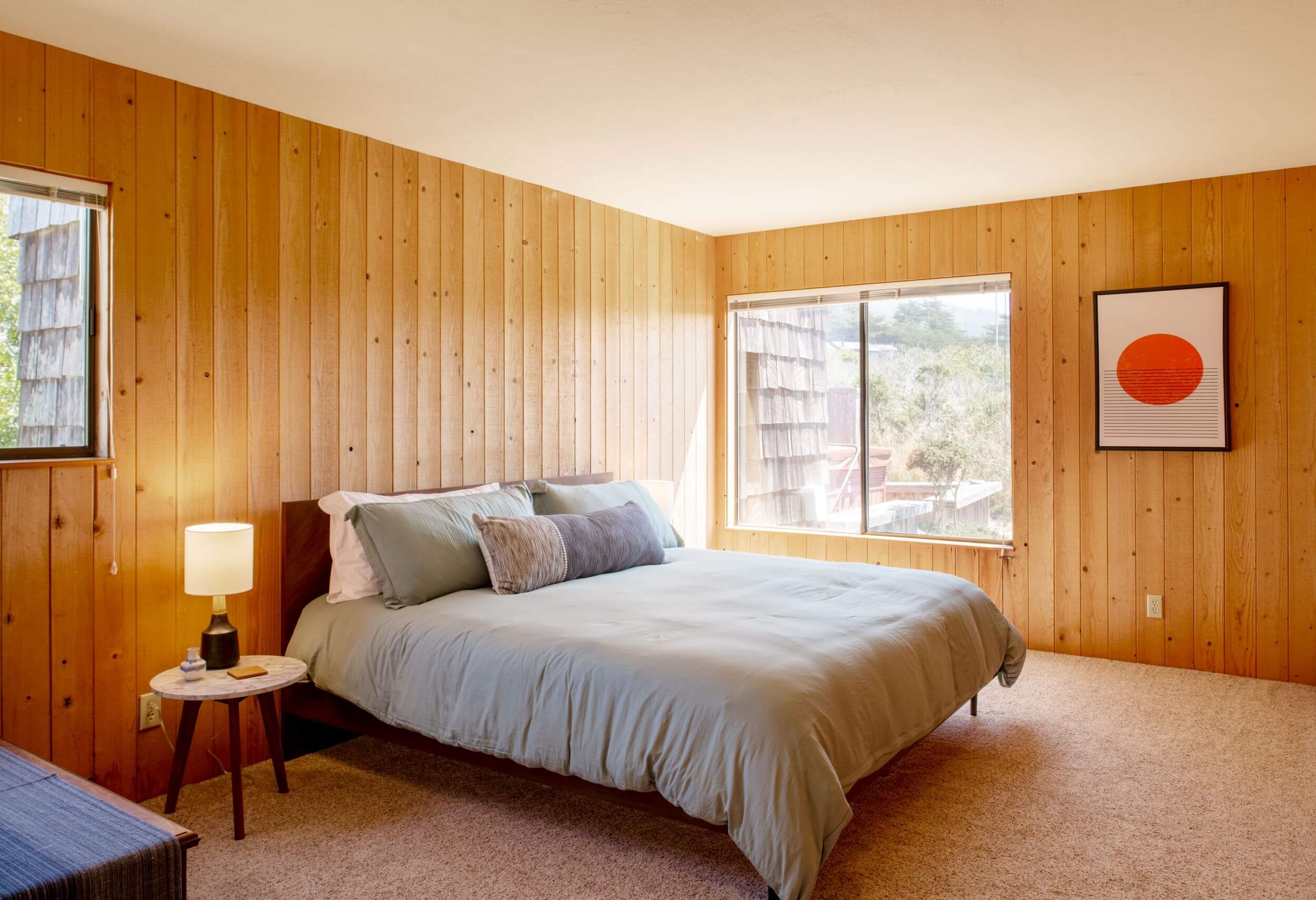 Sea Meadow: 1st large bright bedroom with wood walls and large window looking onto meadow.