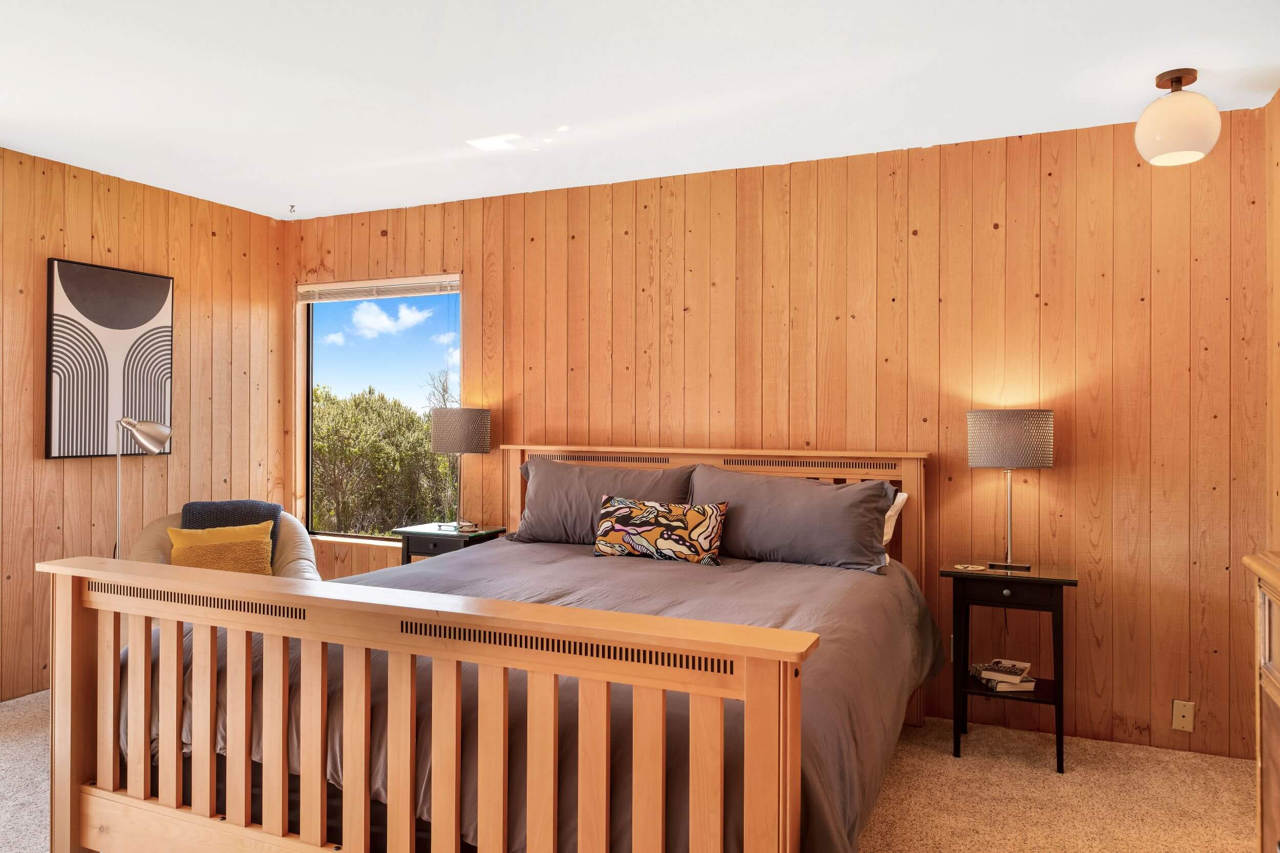 Sea Meadow: 2nd large bright bedroom with wood walls and window looking onto meadow.