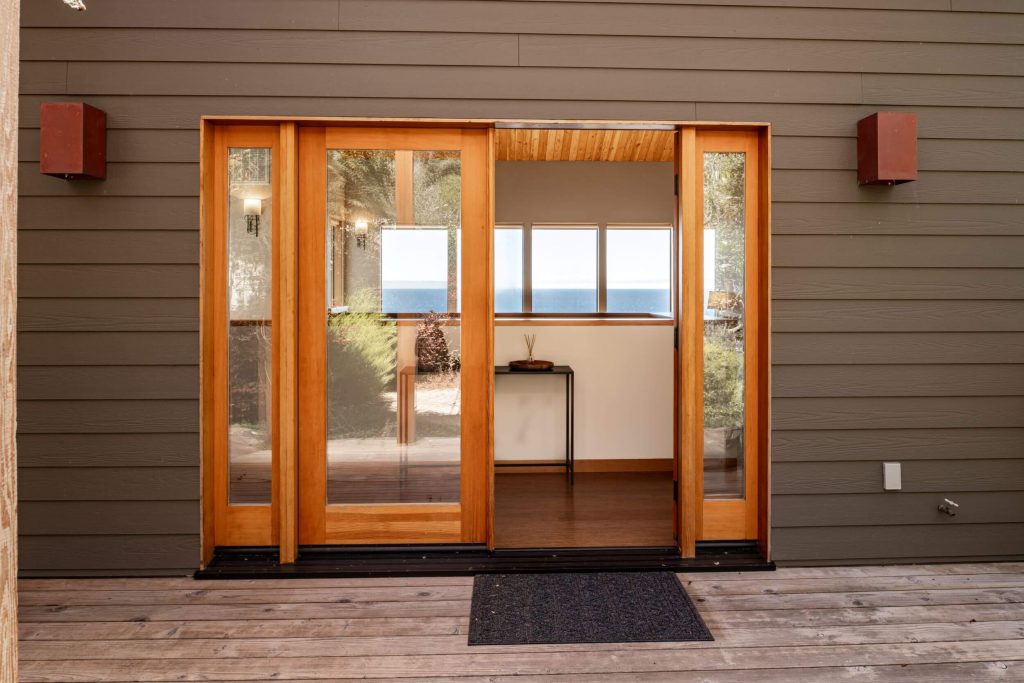 Cornwall West - exterior entryway with large glass wood framed doors