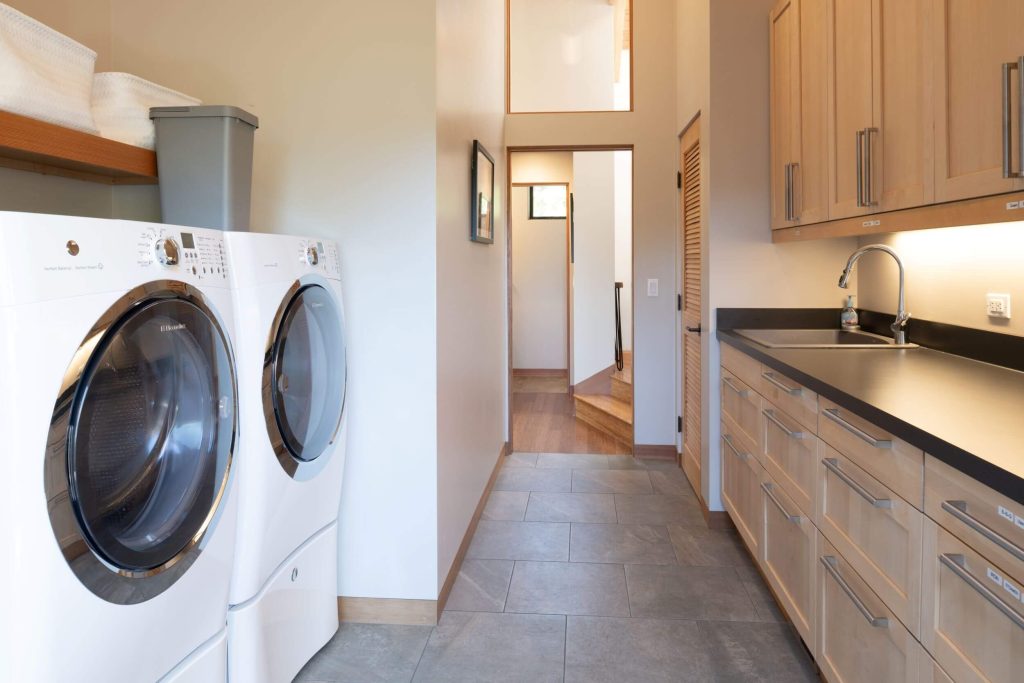 Cornwall West - large bright laundry room with 1/2 bath off kitchen.