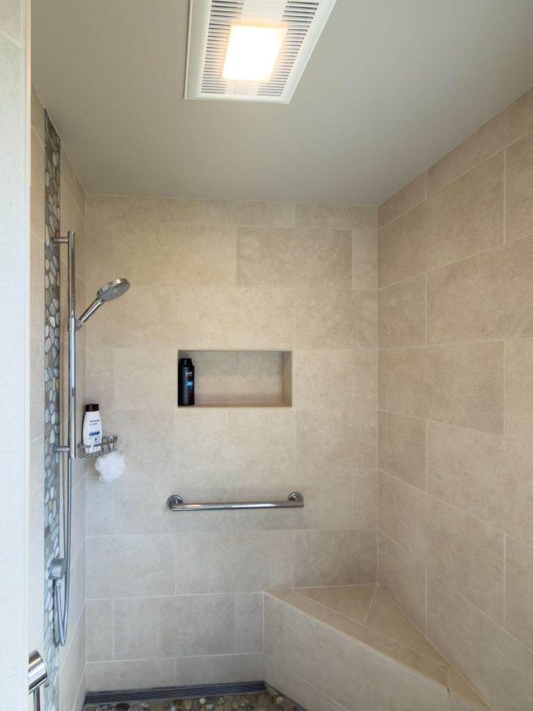 Cornwall West - cozy guest bathroom large marble walk-in shower with seat.