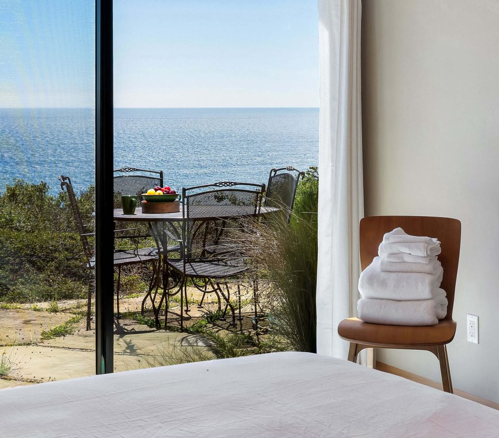 Cornwall West - 2nd guest bedroom doors to patio looking towards ocean.